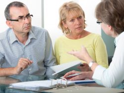 Couple getting financial retirement advice from consultant at home