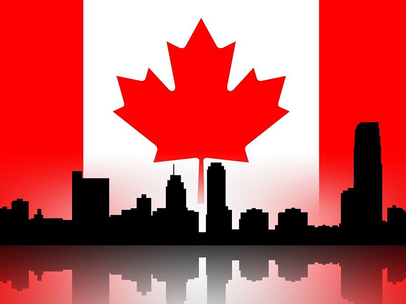 Building silhouettes of a city and Canadian flag