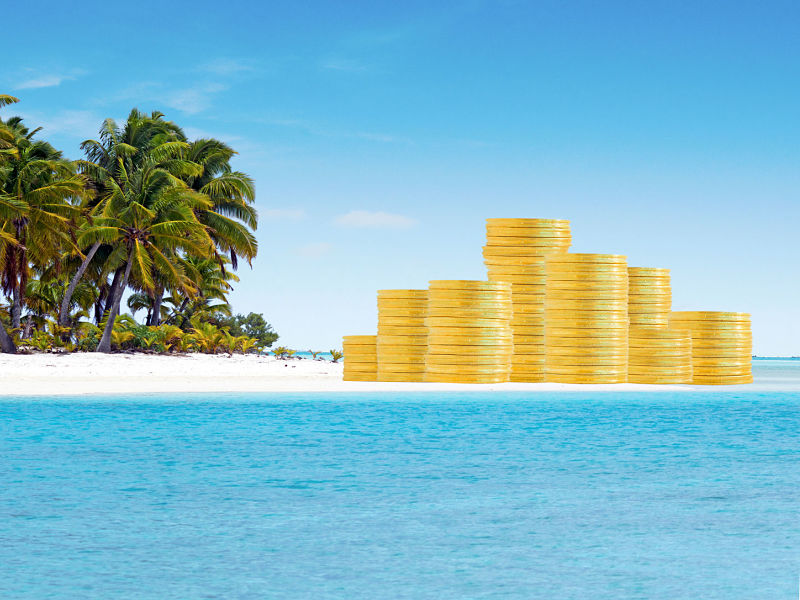 Gold coins on island with palm trees