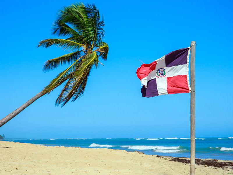 dominican republic flag on the beach