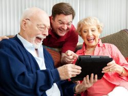 laughing family, senior parents and their adult son