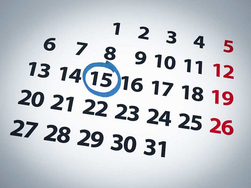 a date circled on a 15th day of a calendar with blue ink