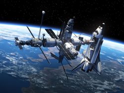 space shuttle and space station in space
