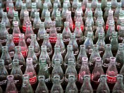 crate of vintage glass coke bottles