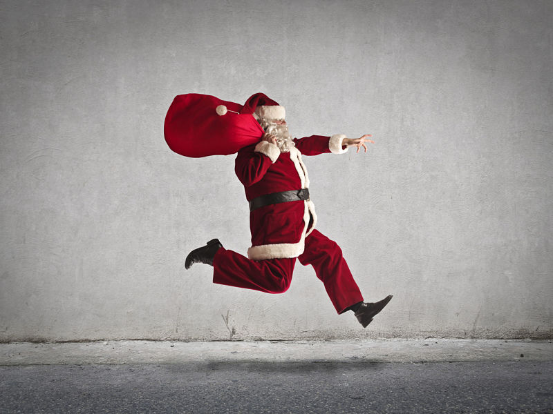 running santa with toy sack
