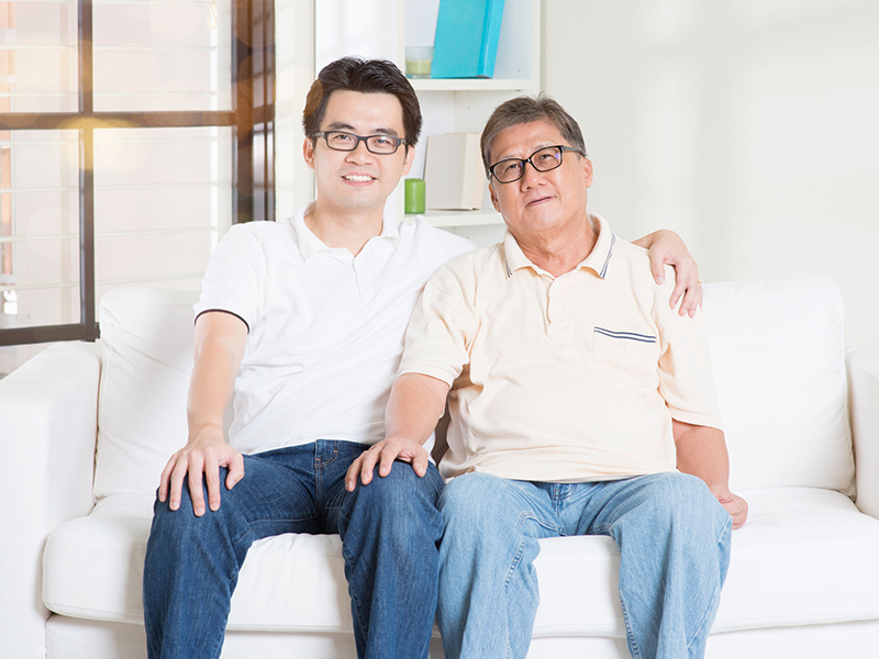 Asian senior father and adult son at home. Family living lifestyle.