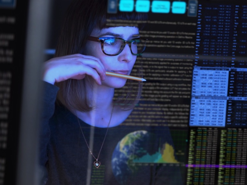 a woman looking at her computer