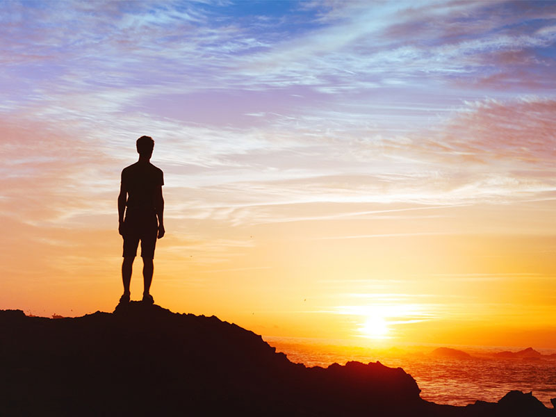 Silhouette of man at sunset