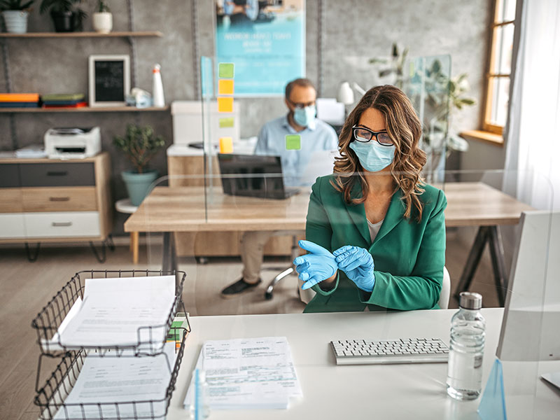 office workers wearing gloves and masks