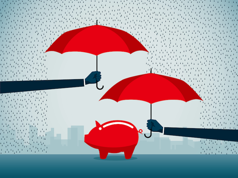 Piggy bank under umbrella