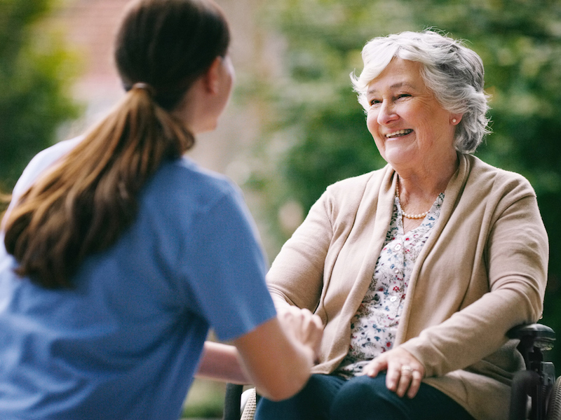 Shot of a senior woman in a wheelchair being cared for a nurse