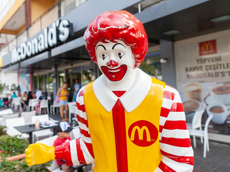 Ronald Mc Donald mascot stands in front of a Mc Donalds shop in Antalya