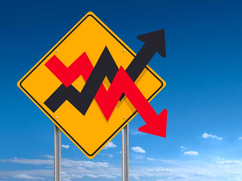 An informational traffic sign post indicating the financial market business concept of volatility