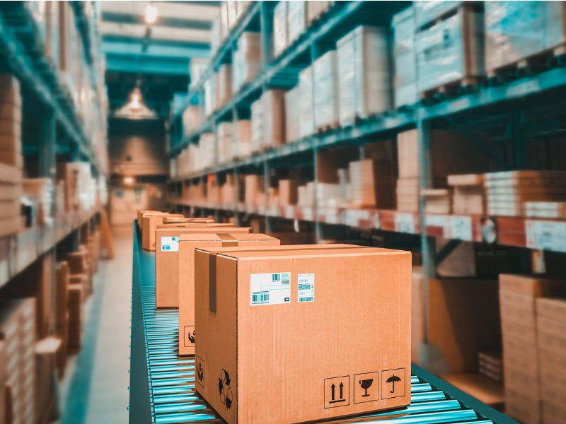 Parcels on conveyor belt in a warehouse