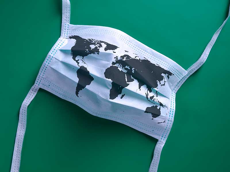 face mask with map of world printed on it