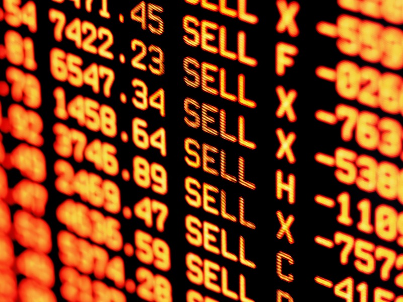 Trading screen financial data in red. Selective focus.