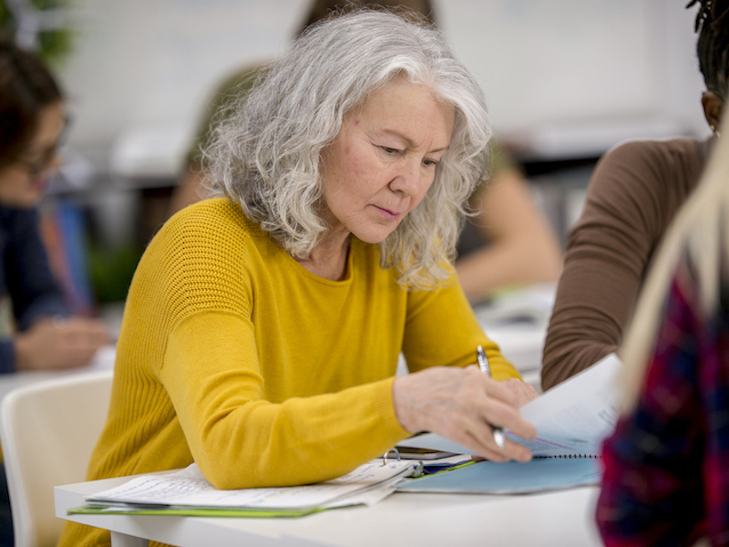 Senior Woman Studying alternate text for this image