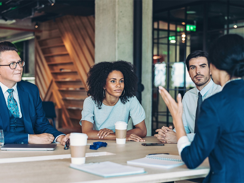 Group of business persons discussing business