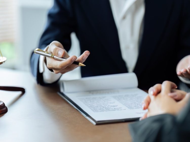 Client listening to a lawyer or advisor explaining issues